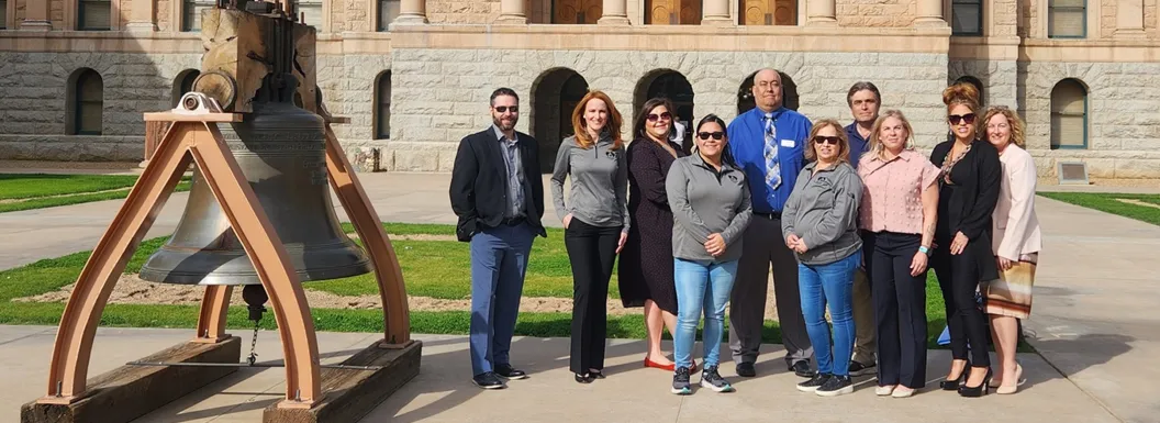 Home Assist Health team posing for a group photo outside in front of a legislator's building