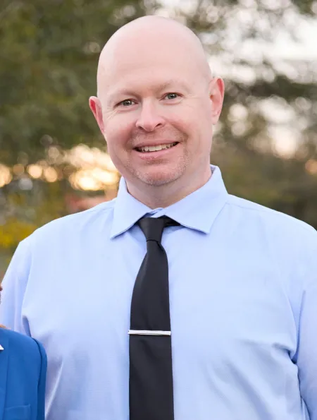 Headshot portrait of Matthew Brosius