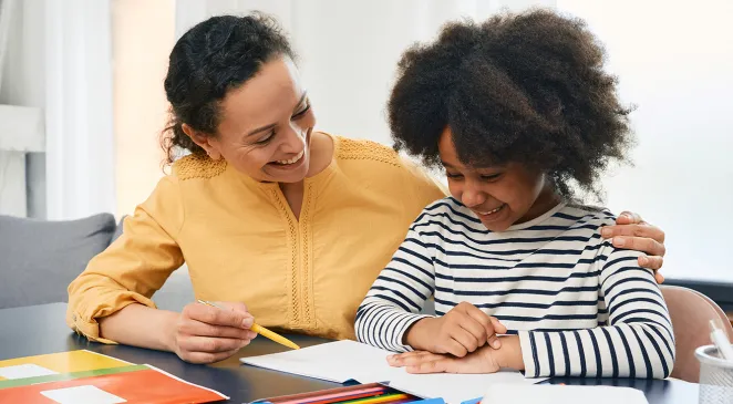 Professional female psychologist works with little girl