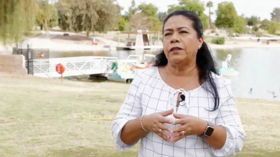 Home Assist Health caregiver talking with a lake in the background